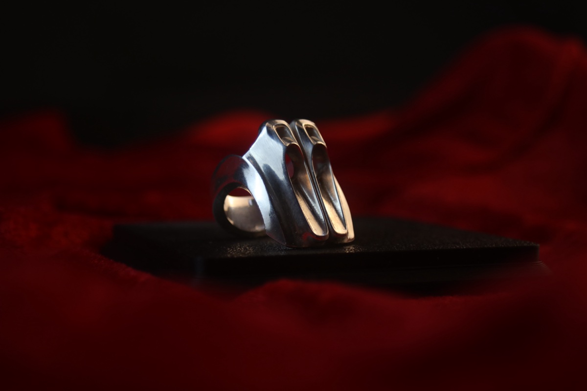 Car Design Ring — held between two fingers, showing scale
